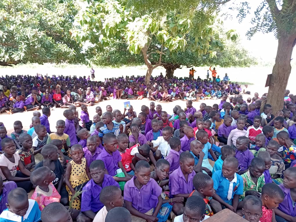 A large gathering of pupils during a Mwesigwa CBO school outreach