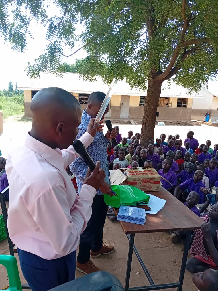 A Mwesigwa CBO presenter addressing pupils during a school outreach